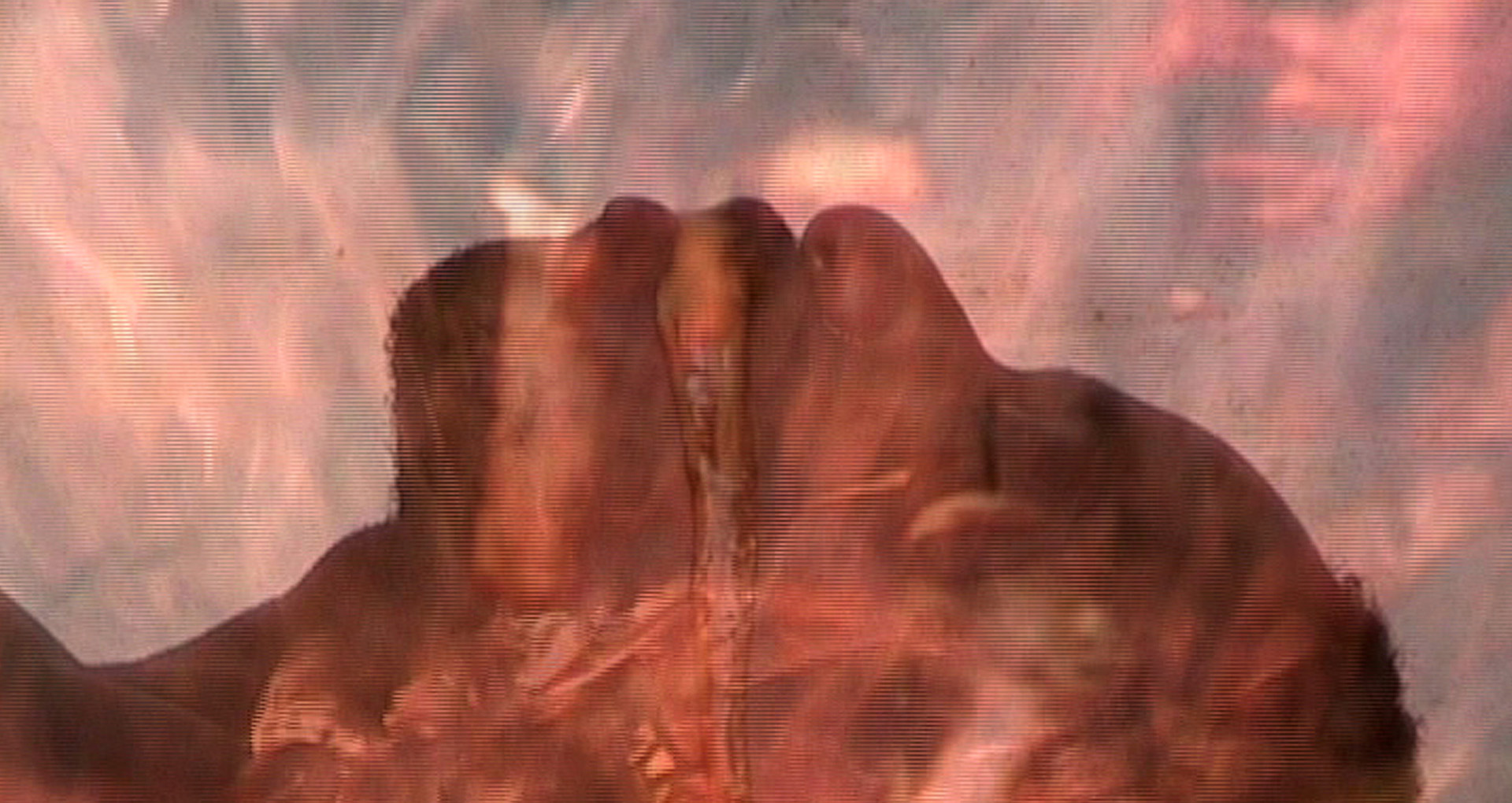 Guy Wouete, Volcano, 2008 Color image. The close-up head of a man. A liquid comes out of his mouth. The image of a fire is superimposed