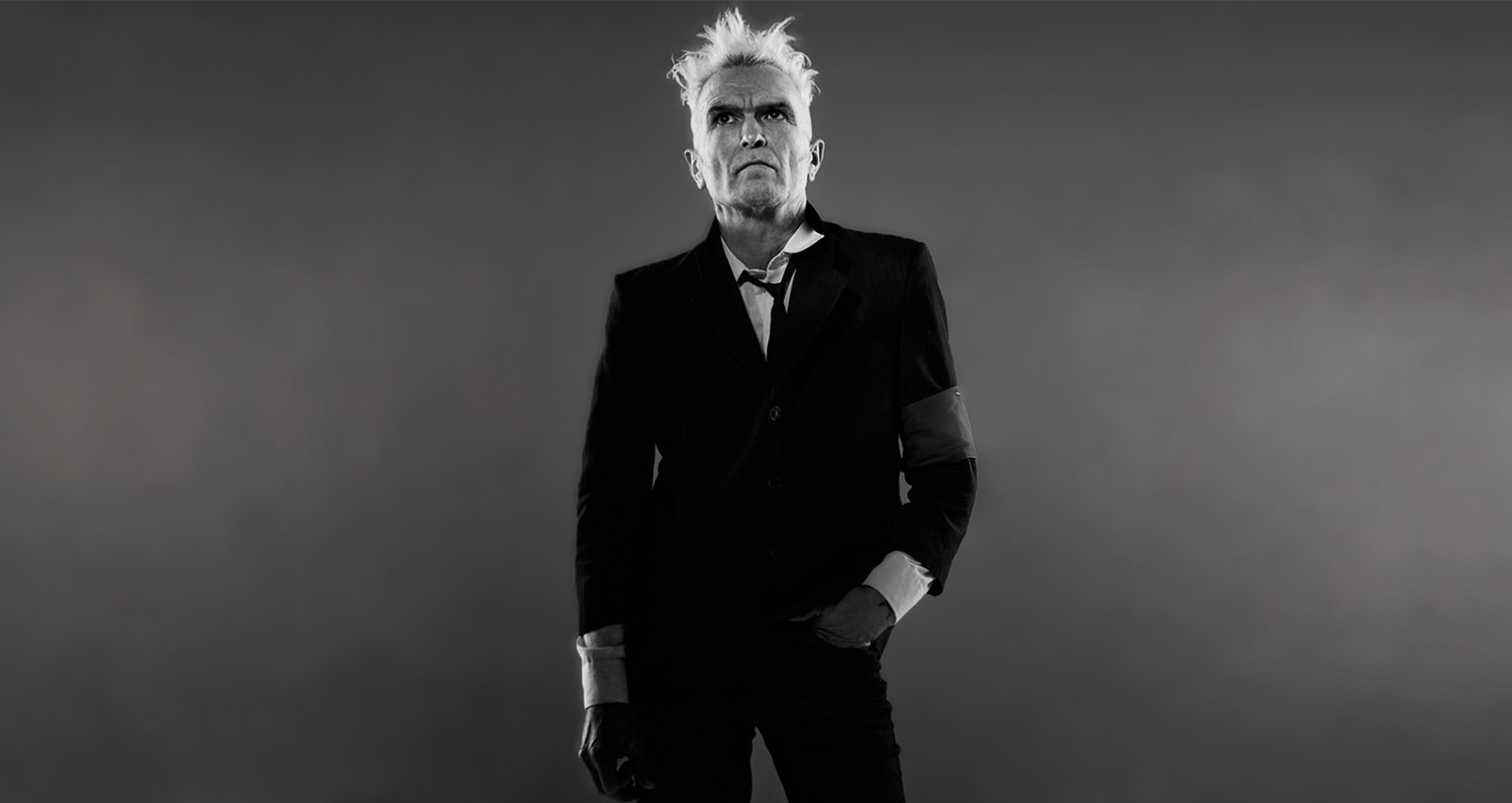 © Istvan Kantor Black and white image. Portrait of man in a black suit