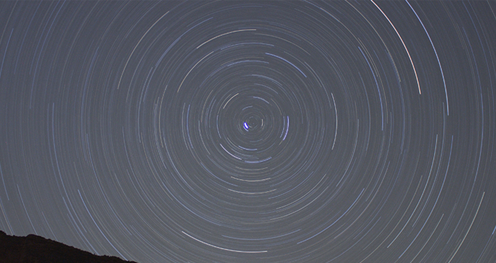 Color photo by night. Spirals in the sky